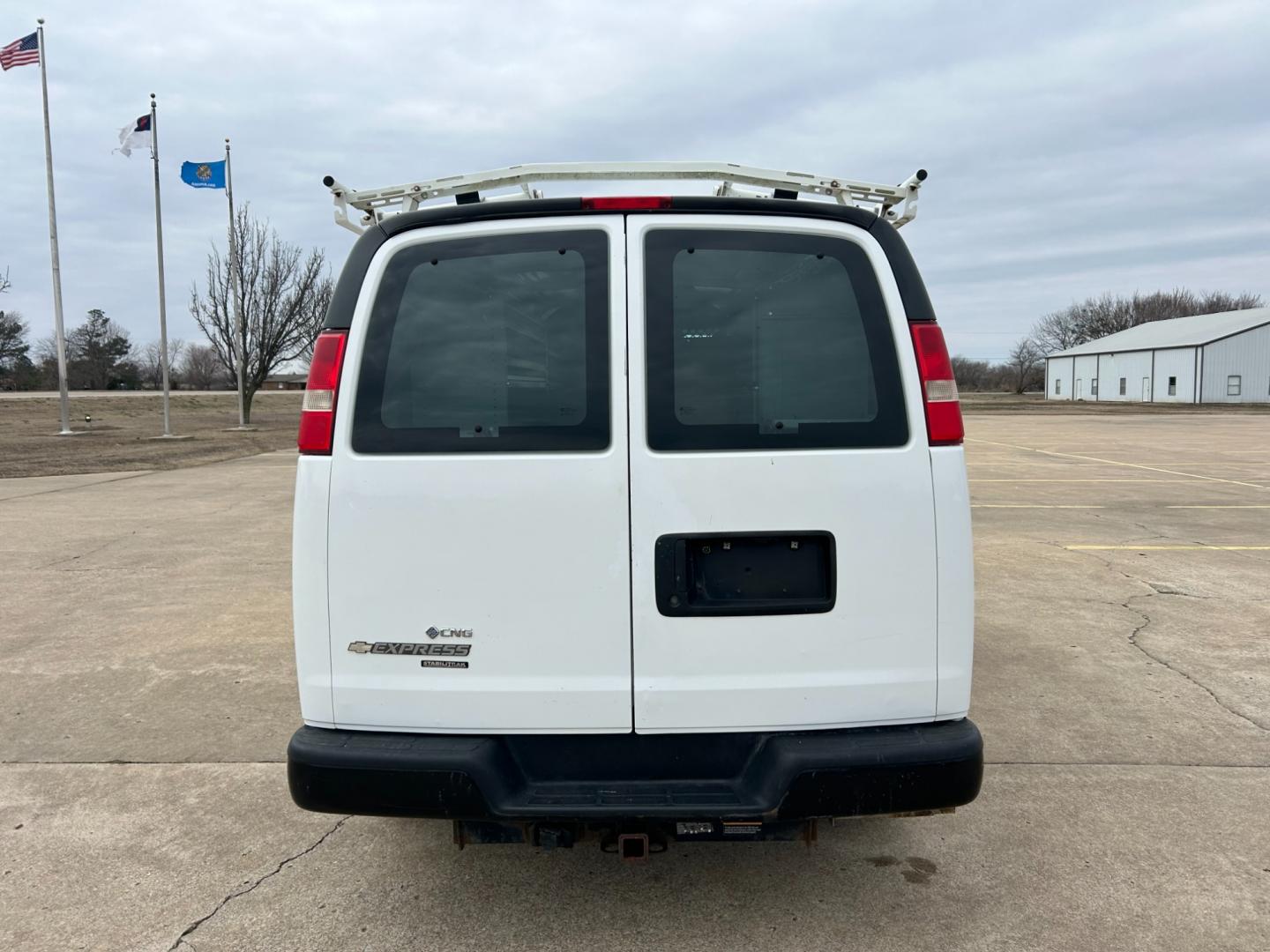 2012 White /Gray Chevrolet Express 2500 Cargo (1GCWGFCB4C1) with an 6.0L V8 OHV 16V FFV engine, 6-Speed Automatic transmission, located at 17760 Hwy 62, Morris, OK, 74445, (918) 733-4887, 35.609104, -95.877060 - 2012 CHEVROLET EXPRESS CARGO VAN 6.0L V8 RWD FEATURING MANUAL LOCKS, MANUAL WINDOWS, MANUAL MIRRORS, MANUAL SEATS, AM/FM STEREO, LEATHER SEATS, LEATHER-WRAPPED STEERING WHEEL, TRACTION CONTROL, LOCKING METAL CONSOLE, STEEL SHELVES, SPLIT SWING-OUT RIGHT DOORS, RUBBER MATS, LOAD-BEARING EXTERIOR RACK - Photo#5